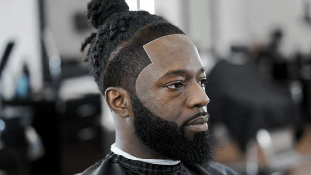 Clean Fade with Locs in a Bun